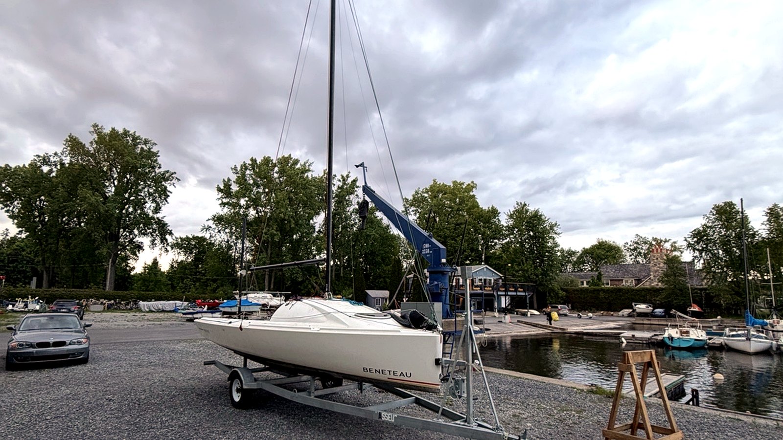 Boat on trailer with mast prepared for transport and launch